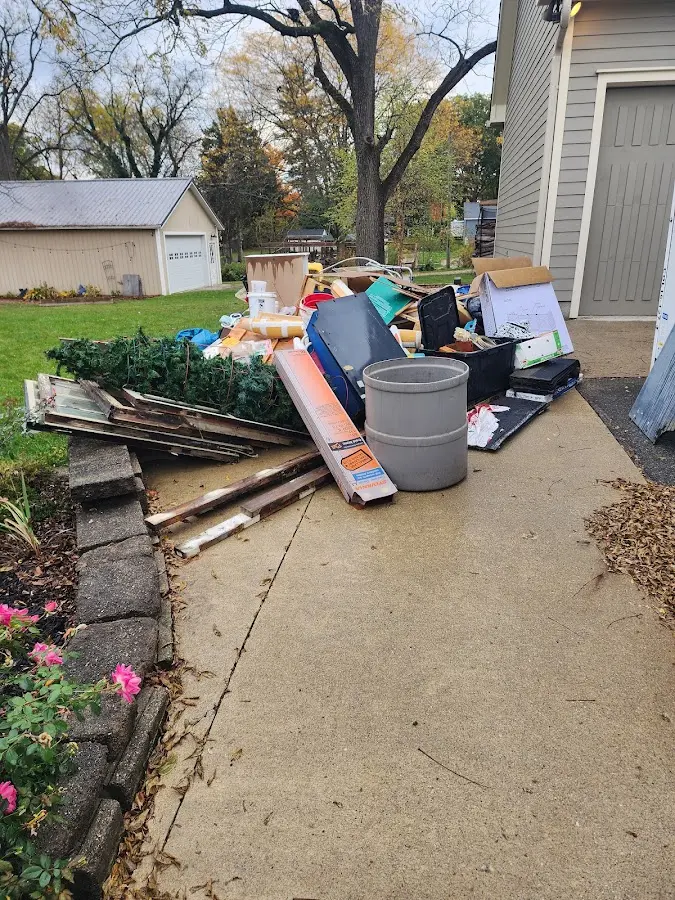 Dumpster being loaded with debris for 3 Yard Dumpster Rental in Egypt Lake-Leto